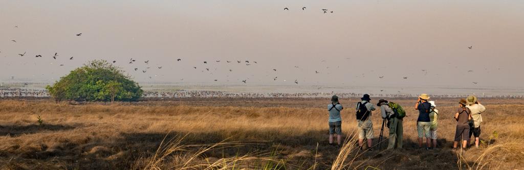 Group at Mumukala wetland, early morning mist and smoke and thousands of waterbirds  (photo copyright Marg Lacey)